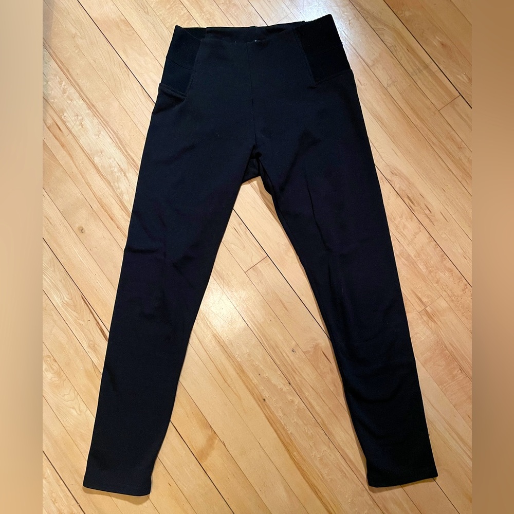 Black leggings, thick elastic side bands, faint pattern, size large